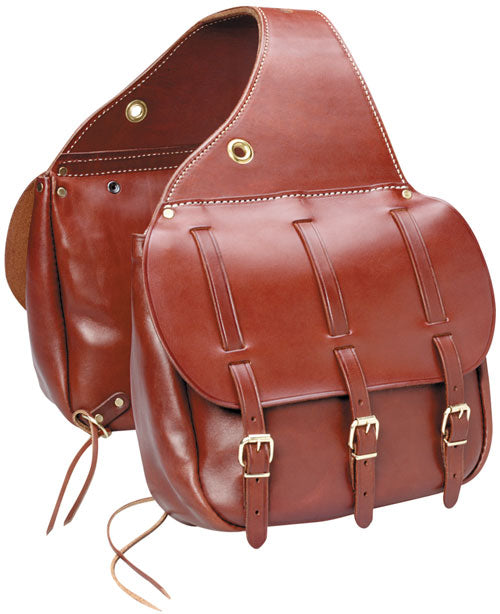 Red-brown saddle bags with three buckled straps, top eyelet and cord ties